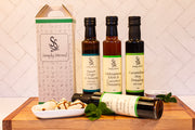 Beautiful image of 4 bottles of Asian influenced dressings Simply Stirred with gift box