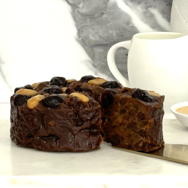 Whole Christmas Cake with piece cut